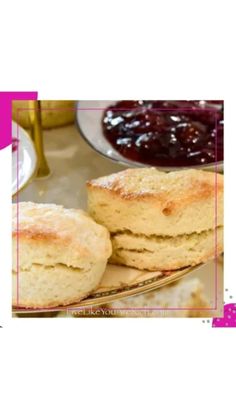 two scones on a plate with jam in the background and a pink frame around it