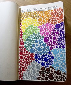 an open notebook with colored circles on it and the words, all this page with circles