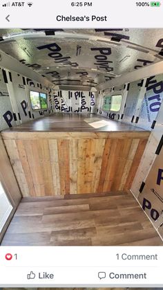 the inside of a trailer with wood flooring