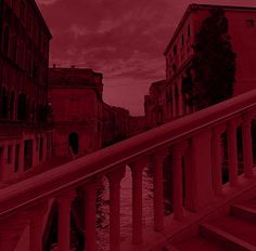 an image of a red sky and some buildings in the background with stairs leading up to them