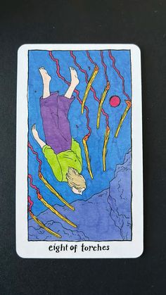 a tarot card with an image of a person falling from the sky in front of them