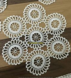 white crocheted doily on wooden surface