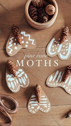 pine cones and scissors are sitting on the floor next to some cut outs that say pine cone moths