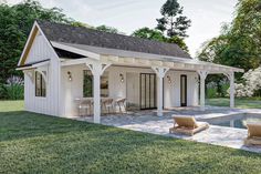 a small white house with a pool in the back ground and two lawn chairs on the side