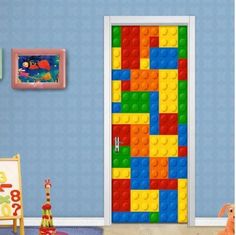 the door is made out of legos in this kids's room with toys on the floor