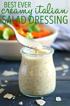 a spoon in a jar filled with salad dressing