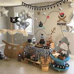 a pirate themed birthday party with balloons and decorations