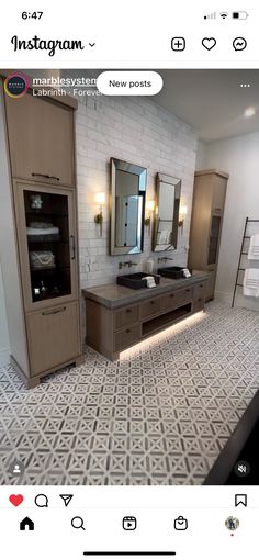 an image of a bathroom with two sinks and large mirrors on the wall above them