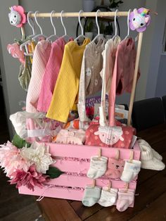 a baby's clothing rack with shoes, socks and other items