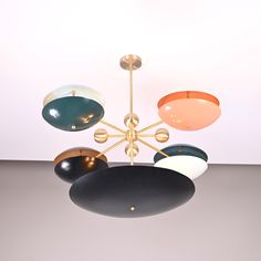 a multicolored chandelier hanging from the ceiling