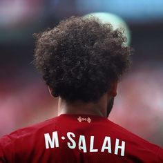 the back of a man's head wearing a jersey with ms salah on it