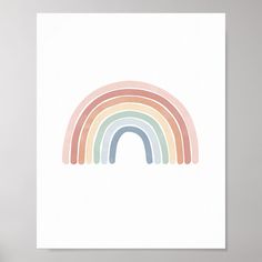 a white poster with a rainbow painted on it's side in pastel colors