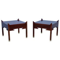 two wooden tables sitting next to each other