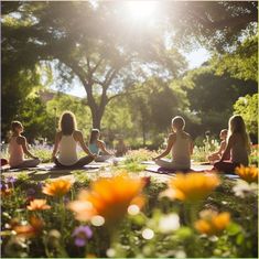 a group of people sitting on top of a lush green field in front of trees