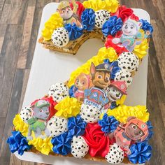 a cake shaped like the number one for paw patrol