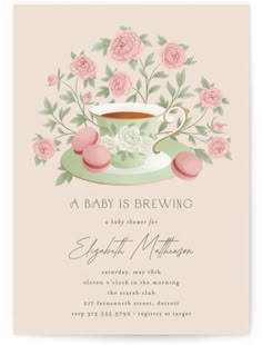 a baby is brewing tea party with pink roses on the cup and saucer in it