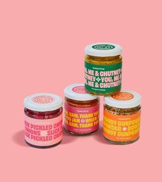 three jars of pickles on a pink background with the words pickle and chutney