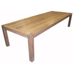 a wooden table sitting on top of a white floor