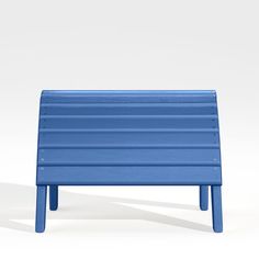 a blue bench sitting on top of a white floor