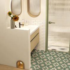 a bathroom with two round mirrors above the sink and a shower stall next to it