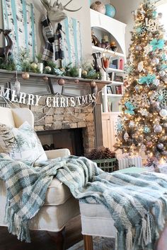 a living room with a christmas tree and fireplace