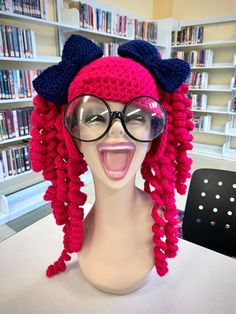 a mannequin wearing glasses and a knitted hat