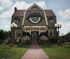 a house with an eye painted on the front