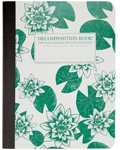 a green and white book with flowers on it