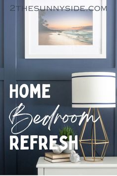 a white lamp sitting on top of a table next to a blue wall with the words home bedroom refresh