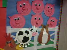 a bulletin board with farm animals on it and paper plates in the shape of pigs