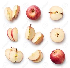 apples cut in half and whole on white background