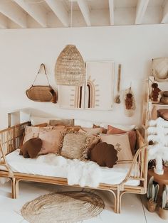 a living room filled with lots of furniture and decor on top of white flooring