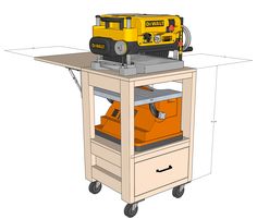 a workbench with tools on the top and drawer below it, including a driller