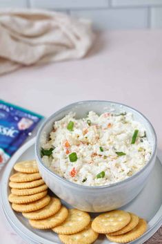 a bowl of rice and crackers on a plate