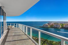 a balcony overlooking the ocean and city