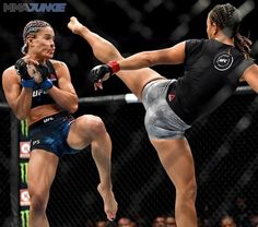 two female fighters in action during a bout