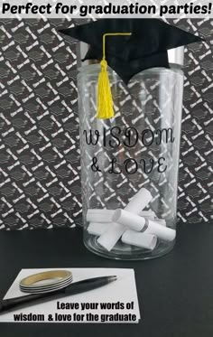 a graduation cap and diploma on top of a clear glass jar with writing that says, i love your words of wisdom & love for the graduate