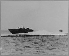 two boats in the water near each other with one boat behind them and another boat on the opposite side