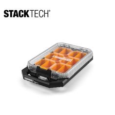 the stack tech tray holds several compartments for small objects, including oranges and black plastic