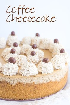 there is a cake with white frosting and chocolate toppings on the top that says coffee cheesecake