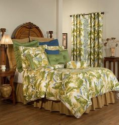 a bed room with a neatly made bed and green curtains on the window sill