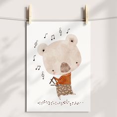 there is a poster with a bear holding a guitar in it's hand and music notes hanging on the clothesline