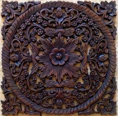 an intricately carved wooden panel on the wall