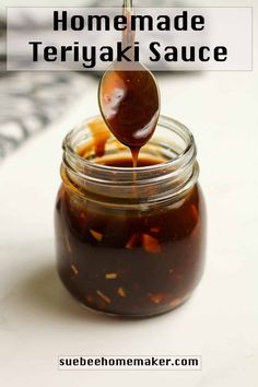 homemade teriyaki sauce in a glass jar with a wooden spoon and text overlay that reads homemade teriyaki sauce