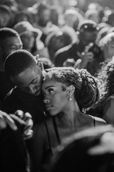 two people are kissing in front of an audience