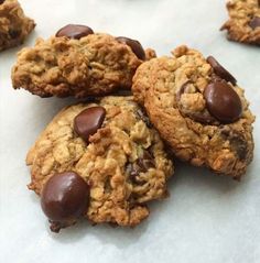 cookies with chocolate chips and oats are on the table ready to be eaten or eaten