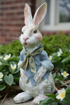 a statue of a rabbit sitting on the ground