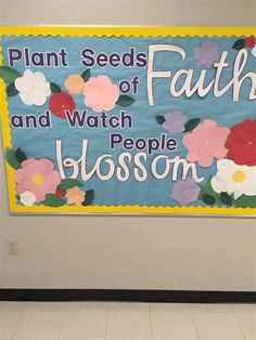 a sign that says plant seeds of faith and watch people blossom on the front wall