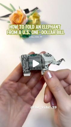 someone is holding money in their hand with the words how to fold an elephant from a us one dollar bill