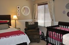 a baby's room is decorated in pink and brown